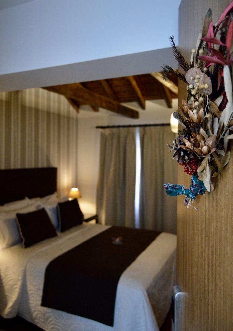 Habitación Deluxe del Casón del Conde, con cama Queen size y vigas vistas